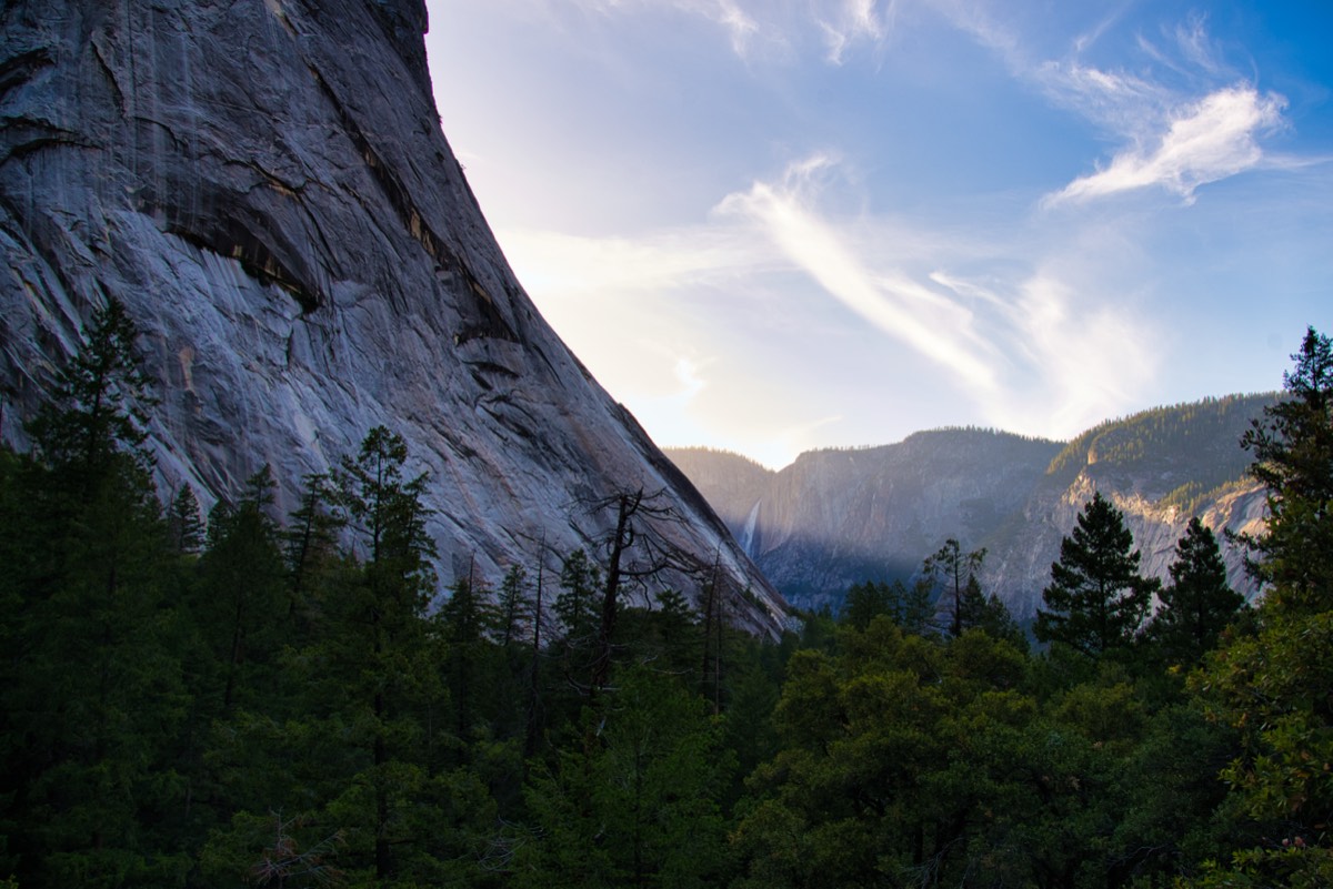 Yosemite valley walls lit warm by low evening sun